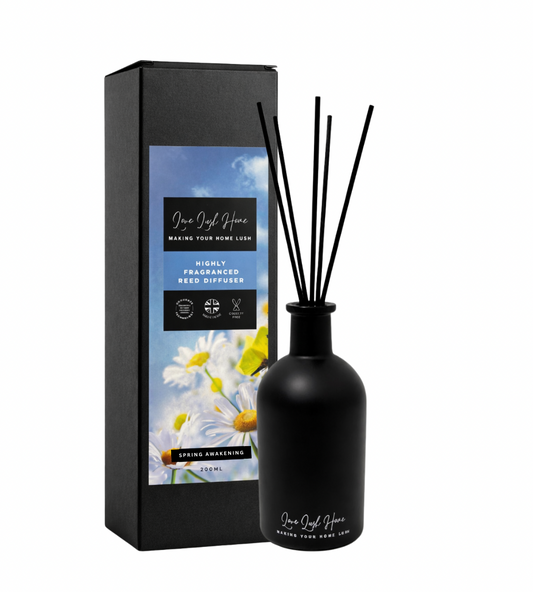Black diffuser bottle with reeds and packaging featuring floral design on a white background. Spring Awakening, anti-odour reed diffuser.